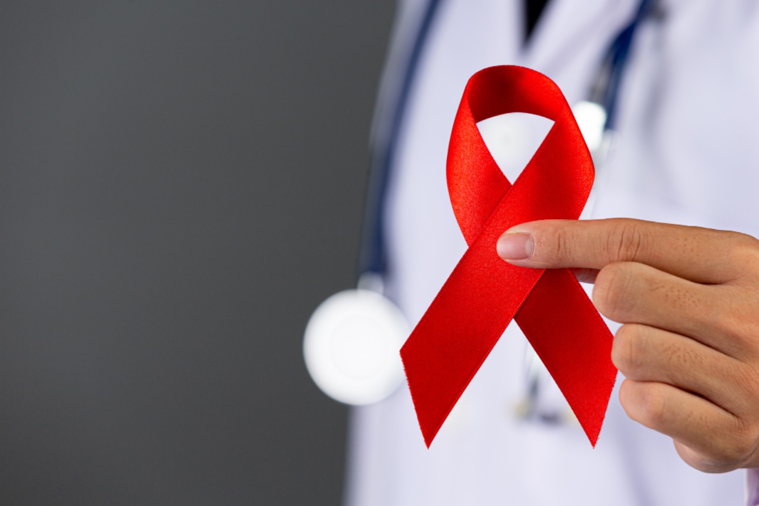 HIV doctor-holds-red-ribbon-hiv-awareness-awareness-world-aids-day-world-sexual-health-day (1)