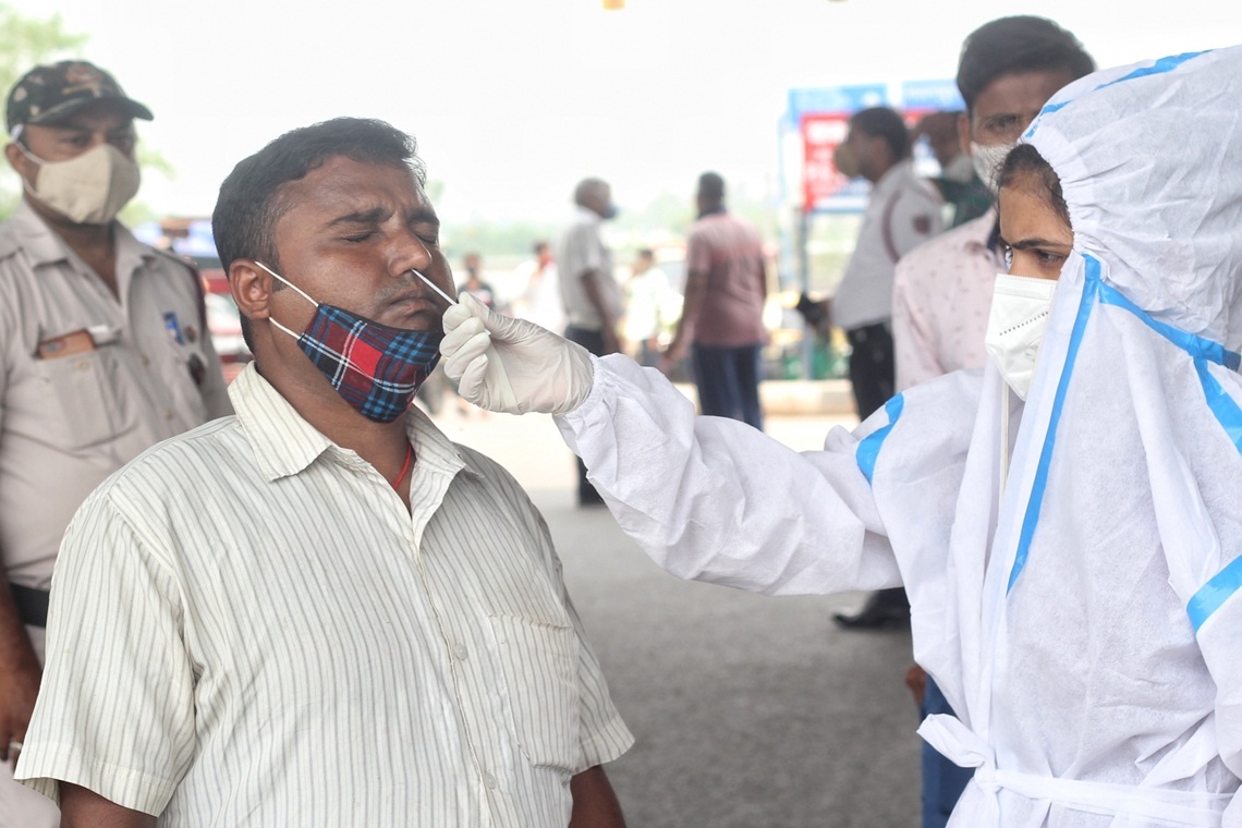 New Delhi: Health worker collect swab sample for Covid-19 testing at Shastri park in New Delhi on Sunday June 13, 2021.(Photo: Wasim Sarvar/IANS)