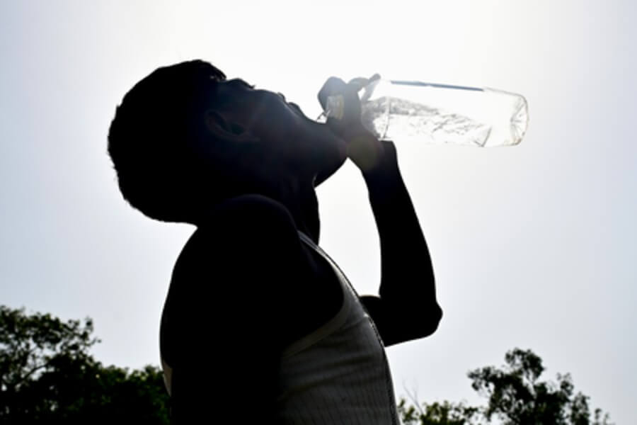 man drinking water hot weather summer season (1) (1)