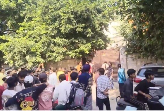 people gathered outside school in Delhi where 12 th student set herself on fire IANS (1) (1)